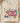 Peace Out Cowboy DTF transfer on cream Comfort Colors blank with realistic illustrated hand making peace gesture, multi-color nails, stacked bohemian bracelets, retro 1970s typography, turquoise lightning, brown horseshoes, and star accents in cozy lifestyle flat-lay presentation