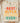 Sand cream Best Black Father Ever shirt with coral orange yellow teal gradient and Africa map folded on wood board