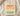 Sand cream Best Black Father Ever shirt with coral orange yellow teal gradient and Africa map folded on wood board