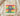 Sand cream Juneteenth celebration shirt with Black Father affirmation words in red yellow green folded on wood board