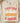 Natural cream labor philosophy graphic tee folded on wooden board showing "Everything Purchased by Labor" design with economic theory message

