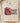 Cow Girl DTF transfer on cream Comfort Colors blank with vibrant pink boots decorated with colorful flowers, matching hat, bright sunflowers, and bold animal-print lettering in cozy lifestyle flat-lay presentation