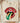 Cream Comfort Colors Juneteenth shirt featuring rock-inspired lips and tongue with Pan-African striped tongue and black outlined text folded on wooden board