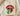Cream Comfort Colors Juneteenth shirt featuring rock-inspired lips and tongue with Pan-African striped tongue and black outlined text folded on wooden board