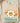Vintage teacher appreciation shirt in cream natural color featuring 70s-style rainbow lettering with happy smiley flower, Comfort Colors brand