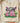 Playful COW GIRL DTF transfer on natural shirt showing cowhide pattern, bright pink lettering, lightning bolt accent, flowers, and saguaro cacti