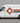 High-tack adhesive vinyl graphics applied to the side panel of a white commercial van